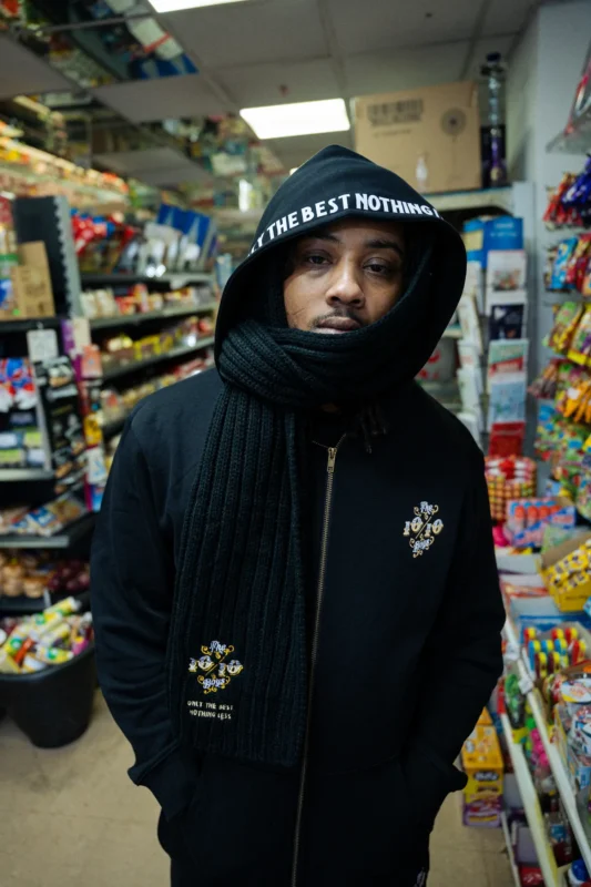 Top streetwear brands style by The 1010 Boys in a black urban winter outfit.