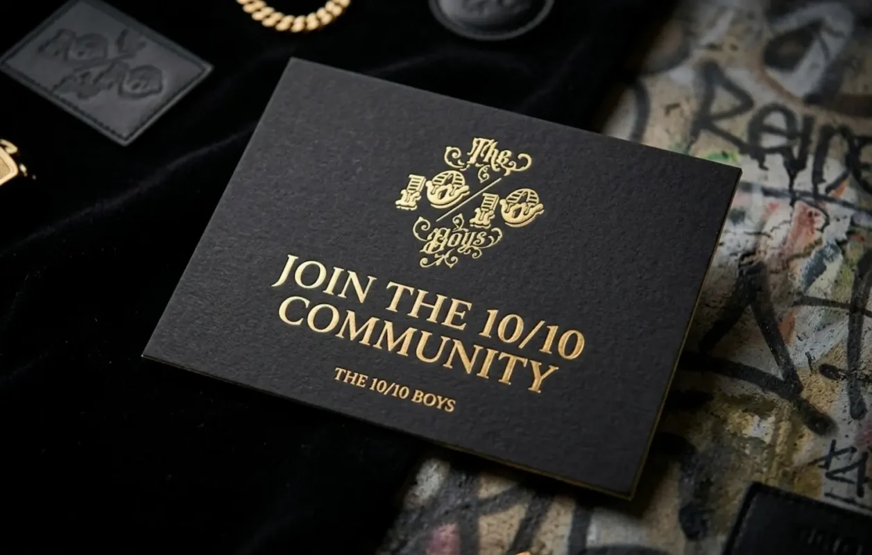 Close-up of a Join the 10/10 Community invitation card with a premium streetwear inner-circle design