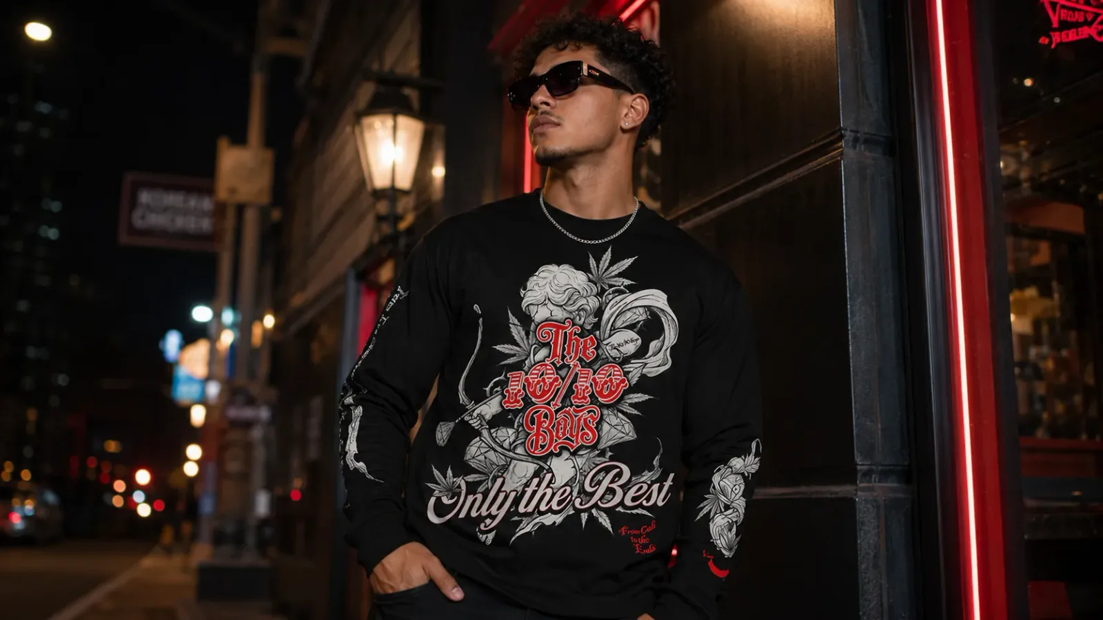 Black 10/10 Boys long sleeve shirt worn at night on an LA-style street, premium streetwear graphic visible