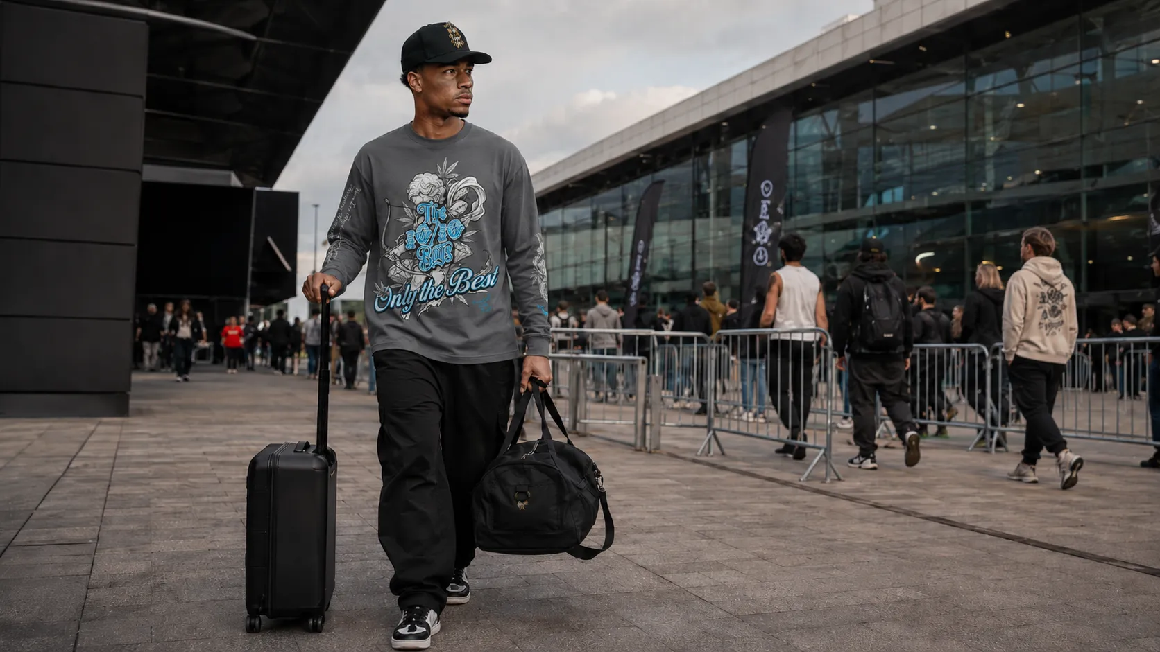 What to pack for a 3-day expo hall day: a grey 10/10 Boys long sleeve and cap with rolling luggage at an event venue