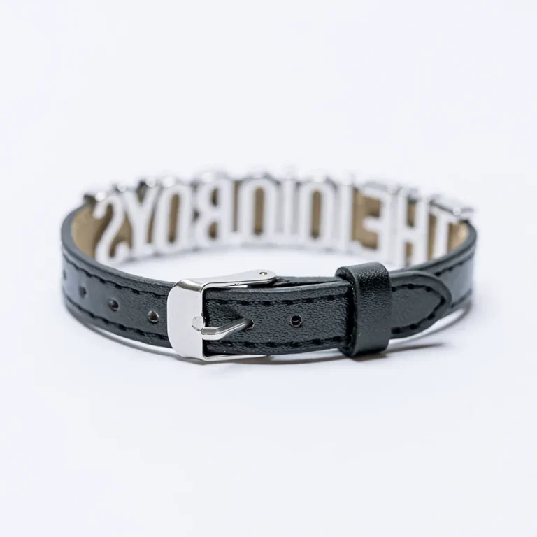 The 10/10 Boys bracelet — detail of the buckle fastening and studded leather strap