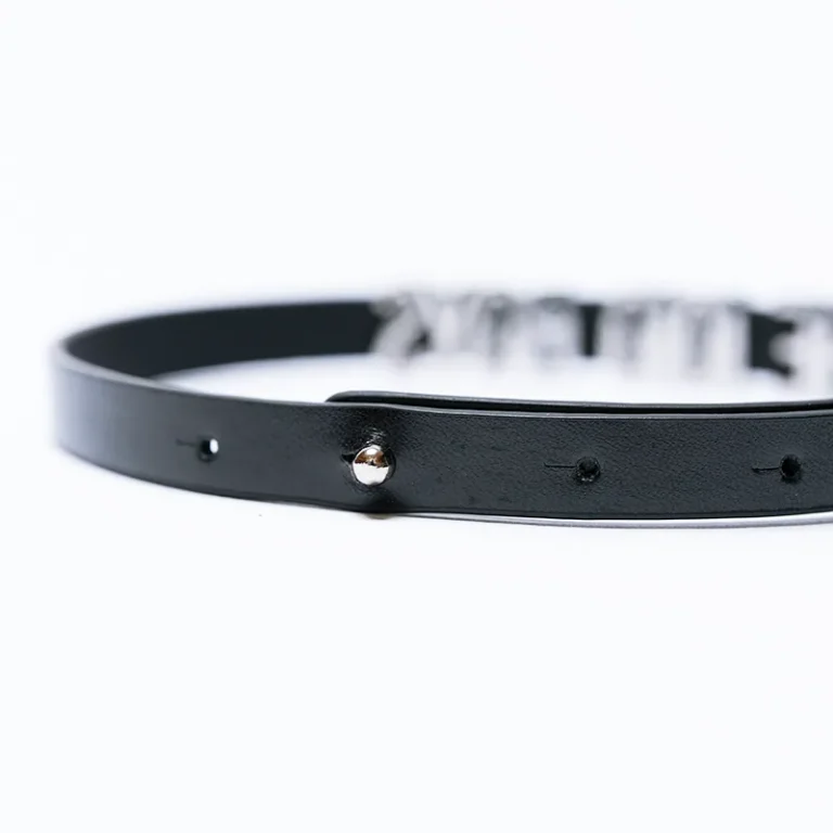 The 10/10 Boys chocker — detail of the metal nameplate and adjustable leather strap
