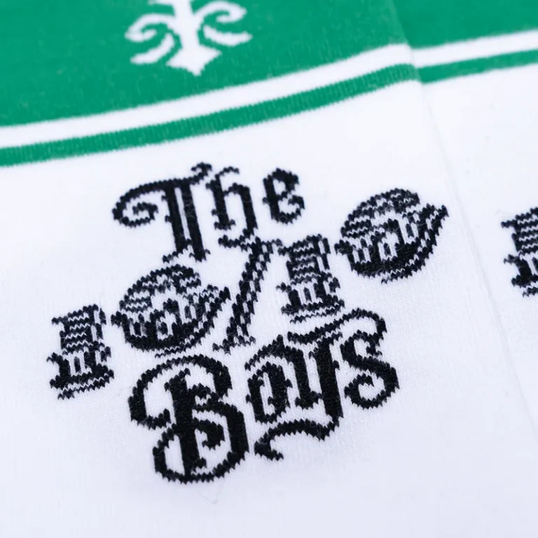 The 10/10 Boys Green Socks — close detail of the gothic 10/10 Boys logo and green cuff band