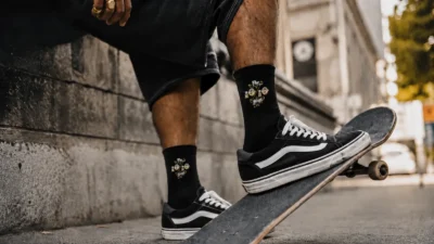 The 10/10 Boys community shown through black streetwear socks in an urban streetwear setting