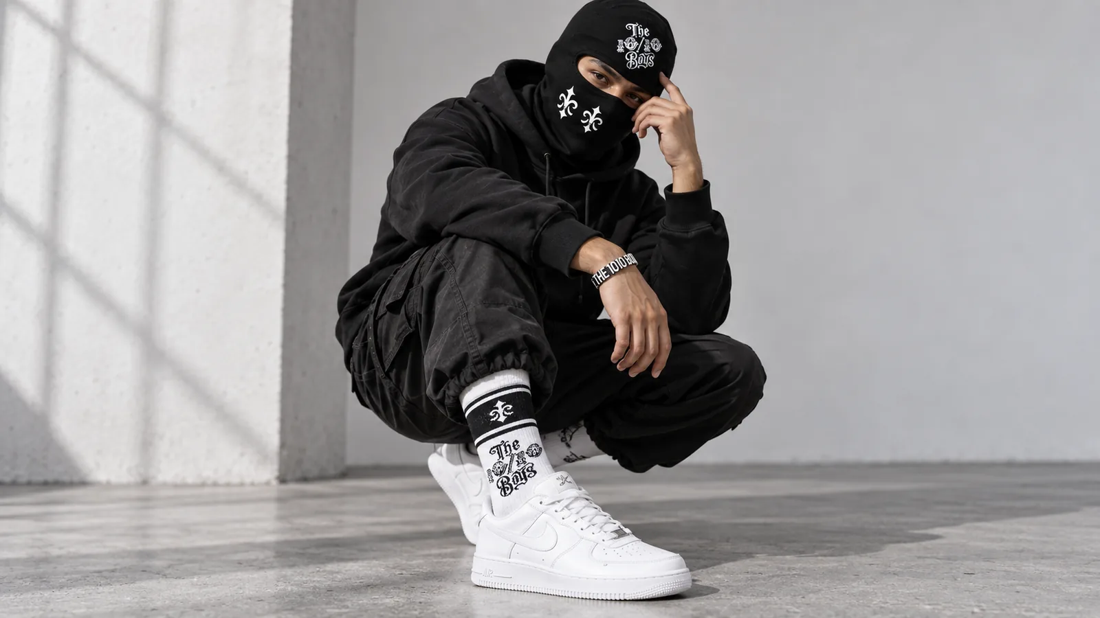 The 10/10 Boys streetwear accessories styled in a black and white outfit