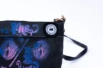 Close-up of the 10/10 Small Bag: sprayed 10/10 lettering, stitching and the GavinBrownArts badge