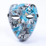 10/10 Mask by GavinBrownArt, covered in blue, black and white 10/10 Boys stickers, front view
